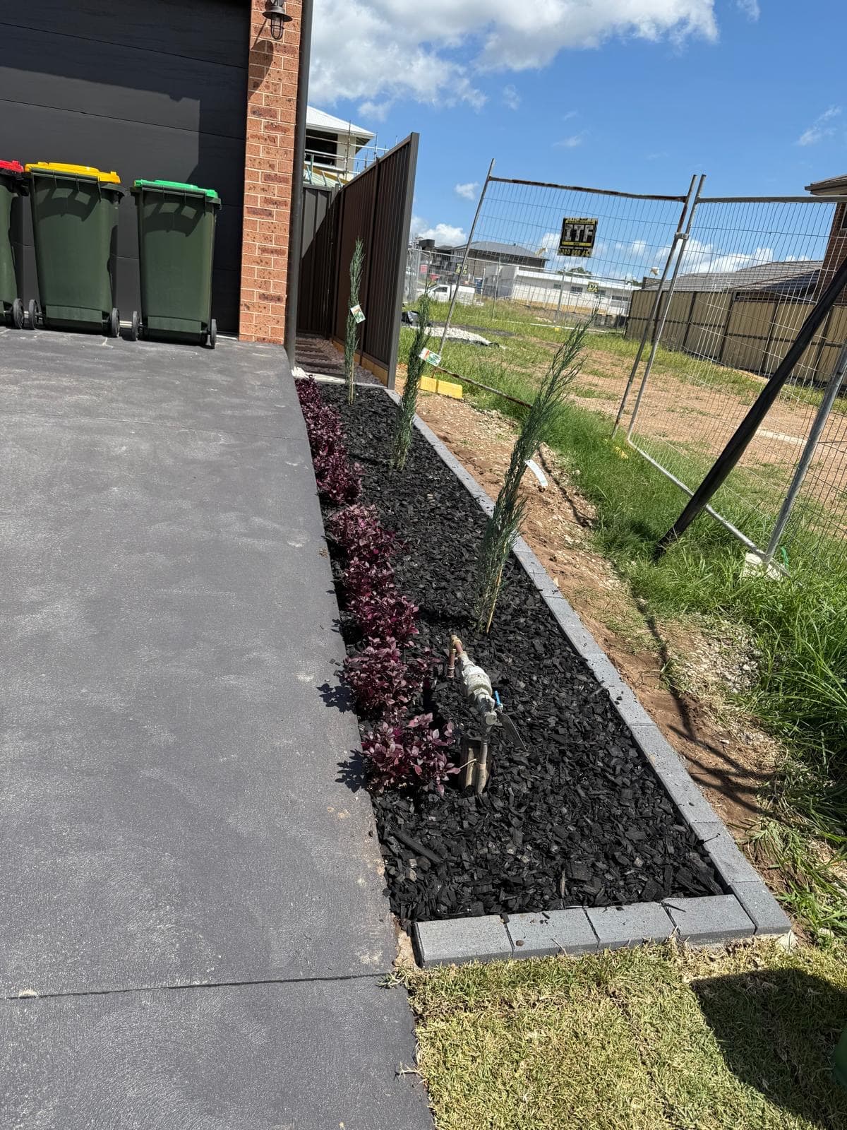 Small backyard landscaping Sydney - maximize space with vertical gardens and limestone paving