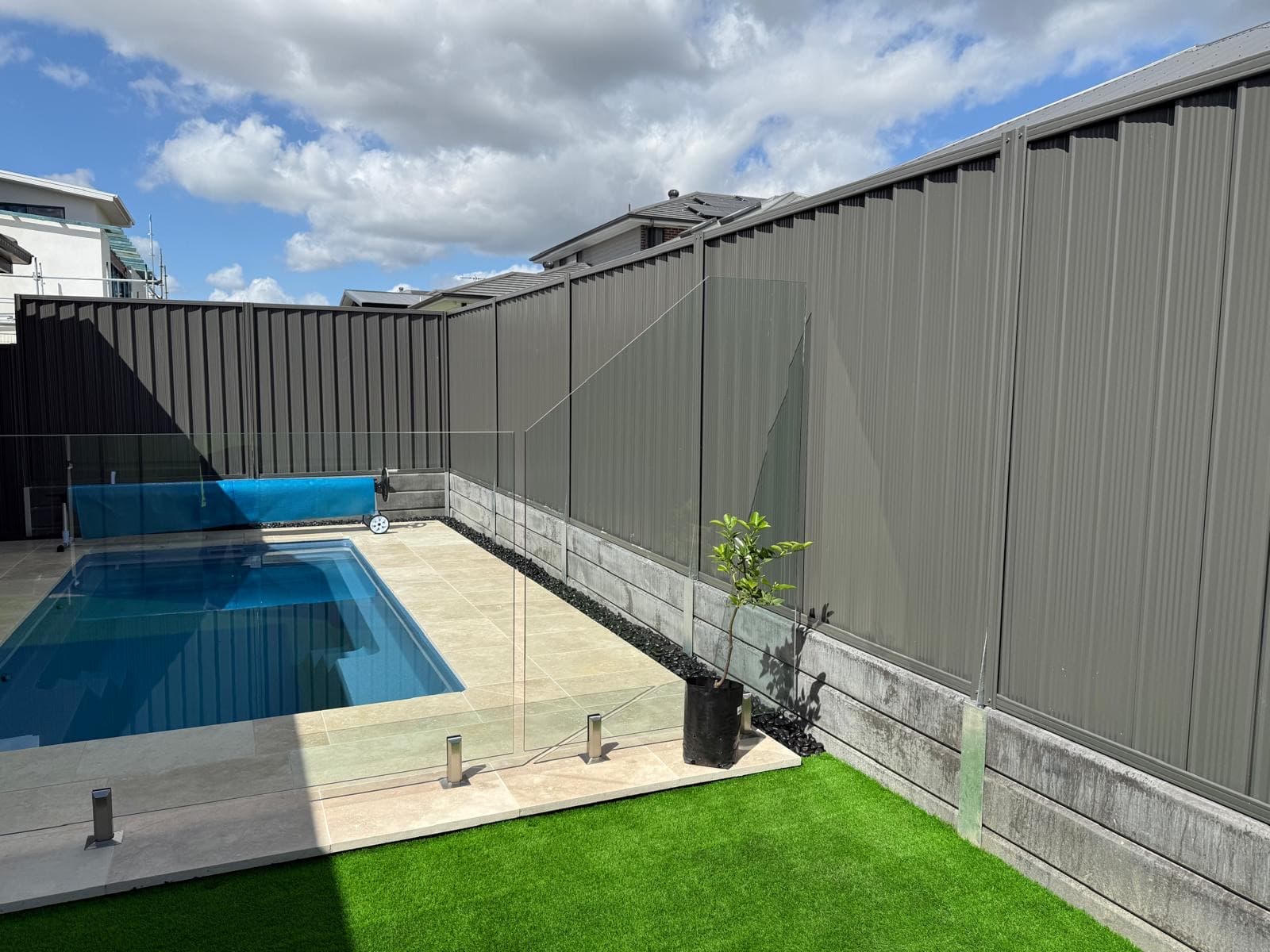 Formal garden design Sydney - symmetrical buxus hedging with standard roses and central feature